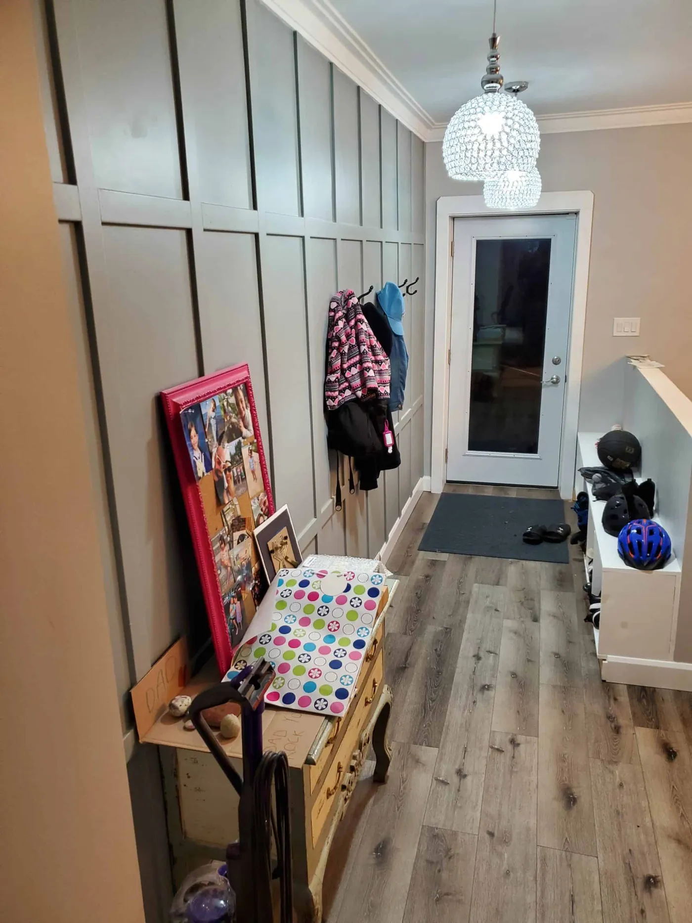 Mudroom with a painted board and batten feature wall